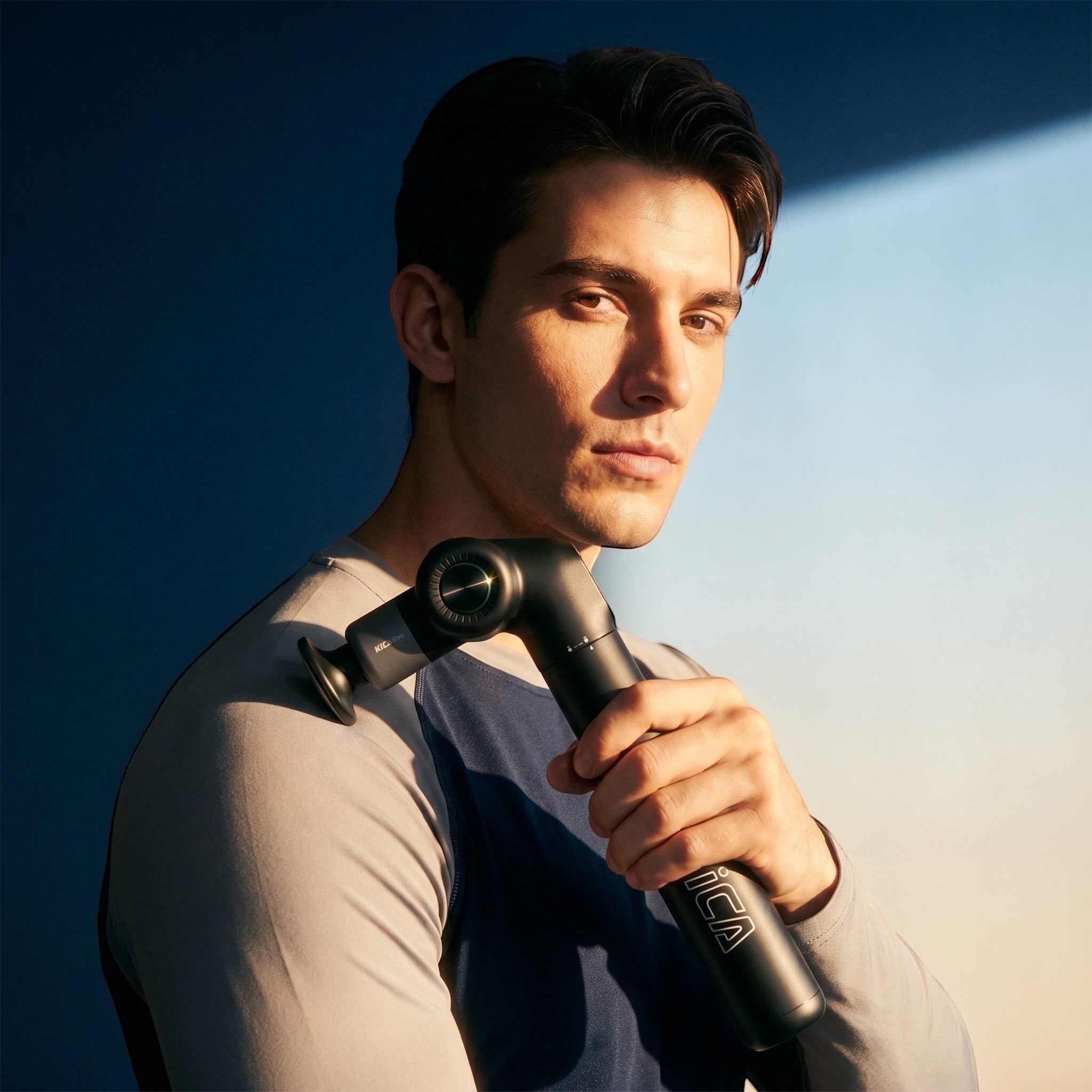Ergonomic heated percussion massager targeting sore muscles with adjustable speed and heat settings