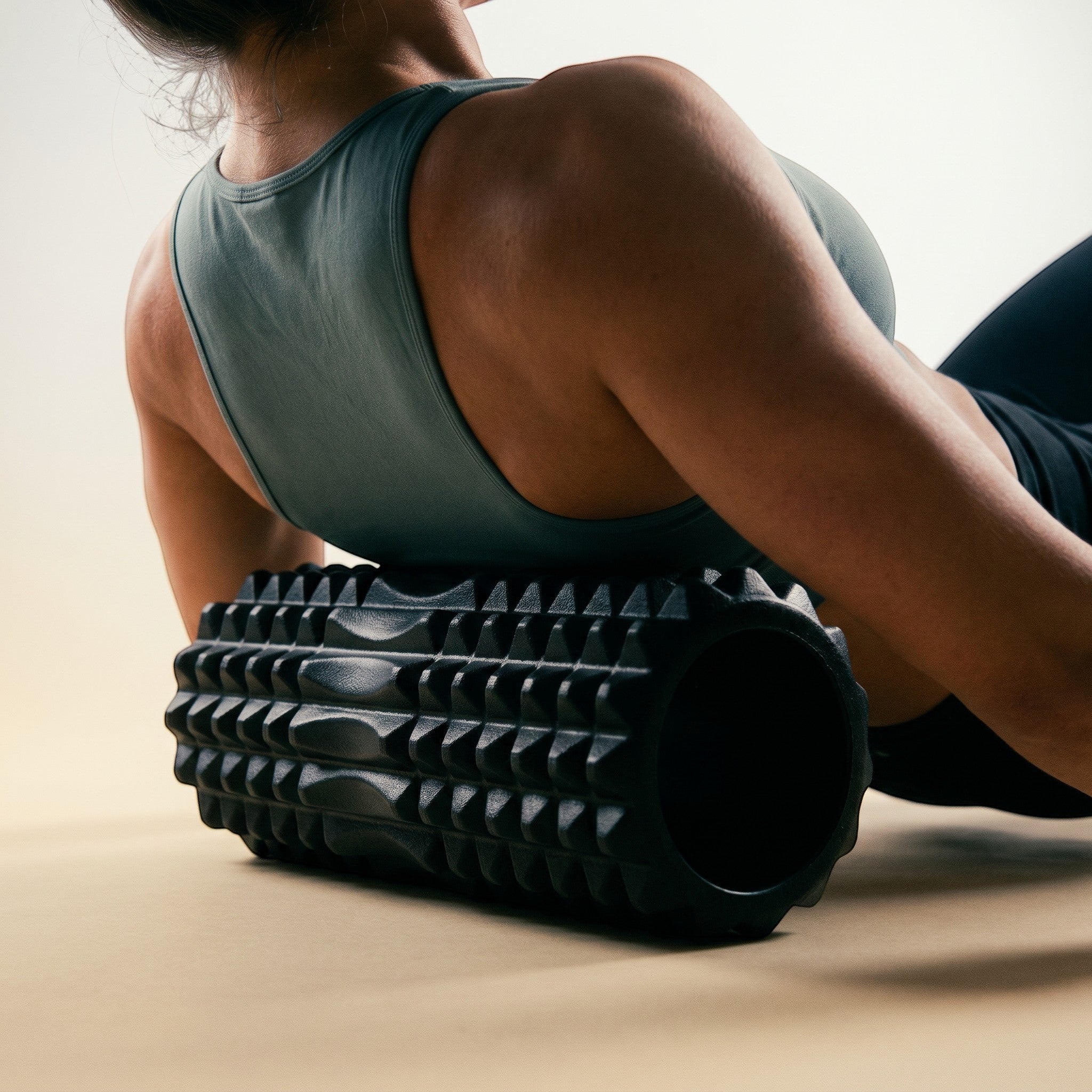 Relief Motion black deep tissue massage foam roller with textured surface for muscle relief and flexibility.